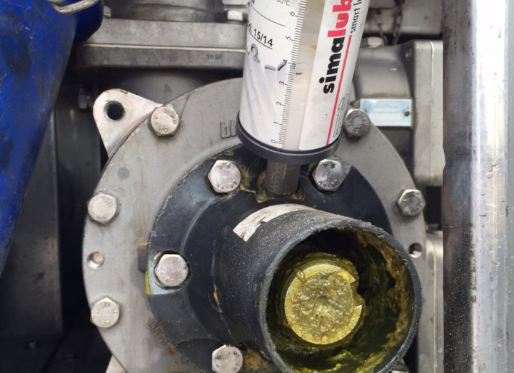 The simalube lubricator seals the outlet of a chemical transport truck.