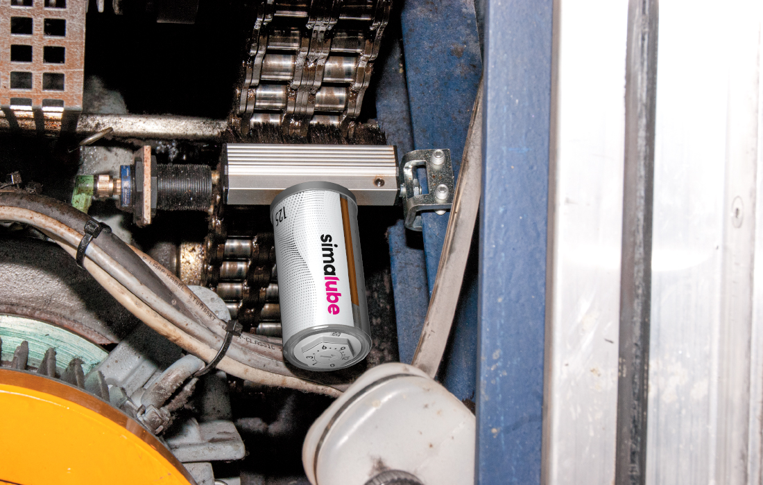 A simalube lubricator oils and cleans the chain of an escalator automatically and constantly.