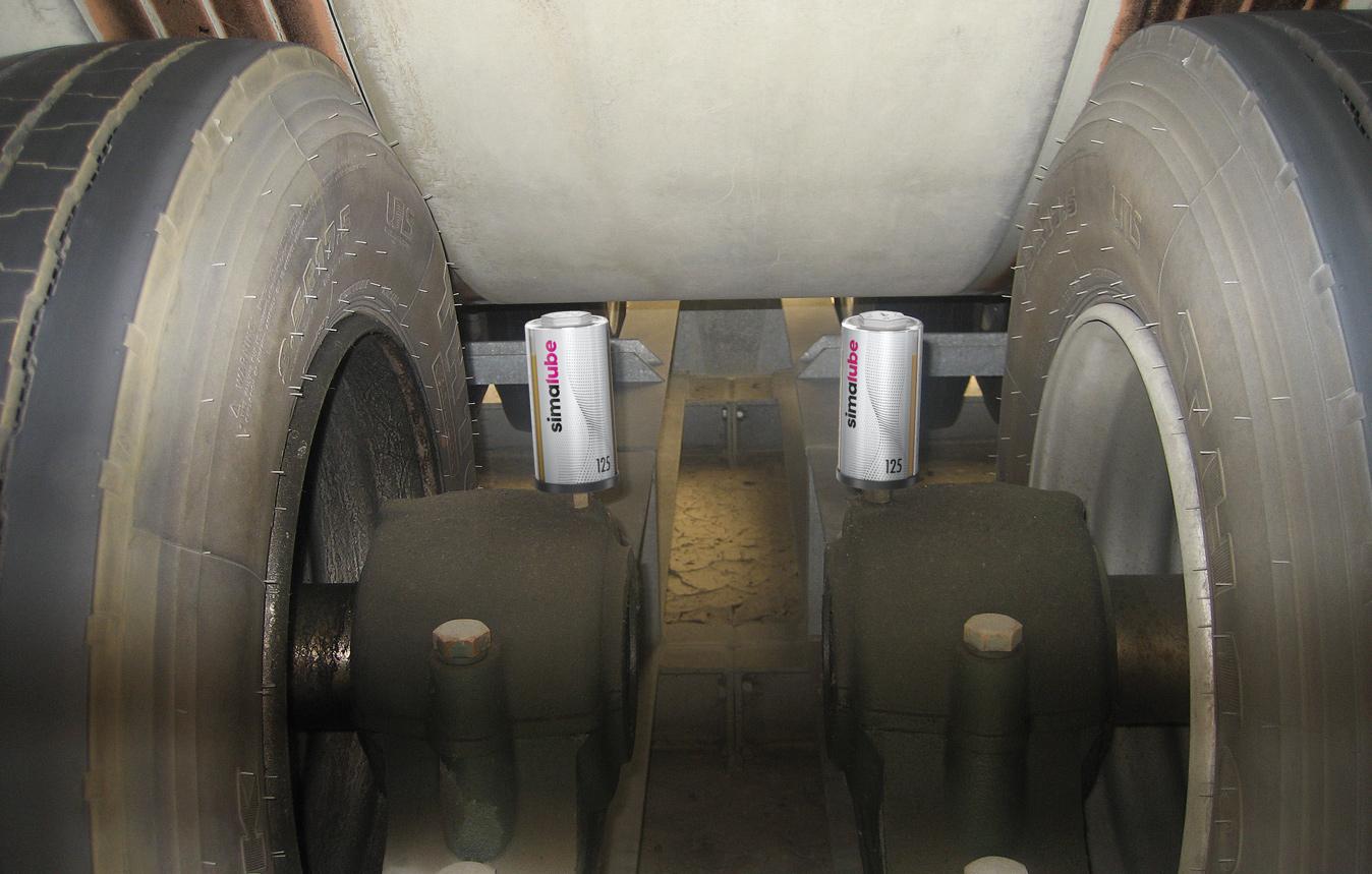 The simalube automatic lubricant cartridges are screwed directly onto the pedestal bearing on the drive of a conveyor belt.