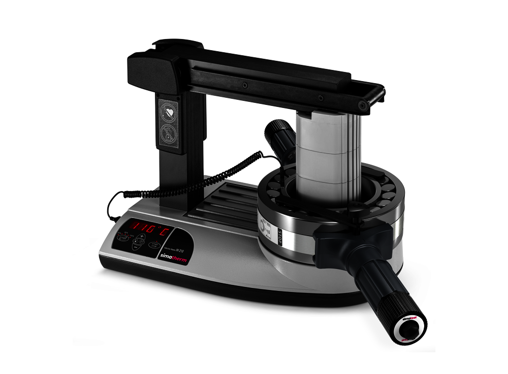 A large spherical roller bearing is heated to a target temperature of 110 °C on the simatherm induction heating unit IH 210. The Bearning Handling Tool 200-400 encloses the outer ring of the bearing for fast and safe mounting.