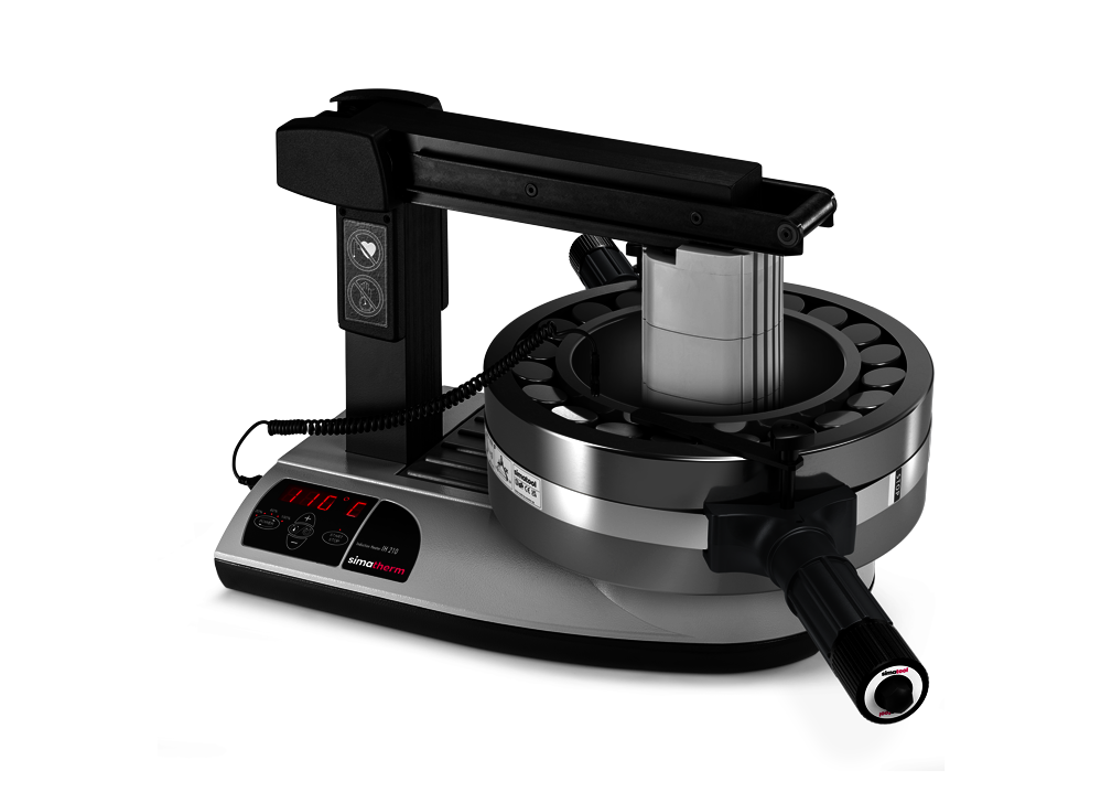 A large spherical roller bearing is heated to a target temperature of 110 °C on the simatherm induction heating unit IH 210. The Bearning Handling Tool 300-500 encloses the outer ring of the bearing for fast and safe mounting.