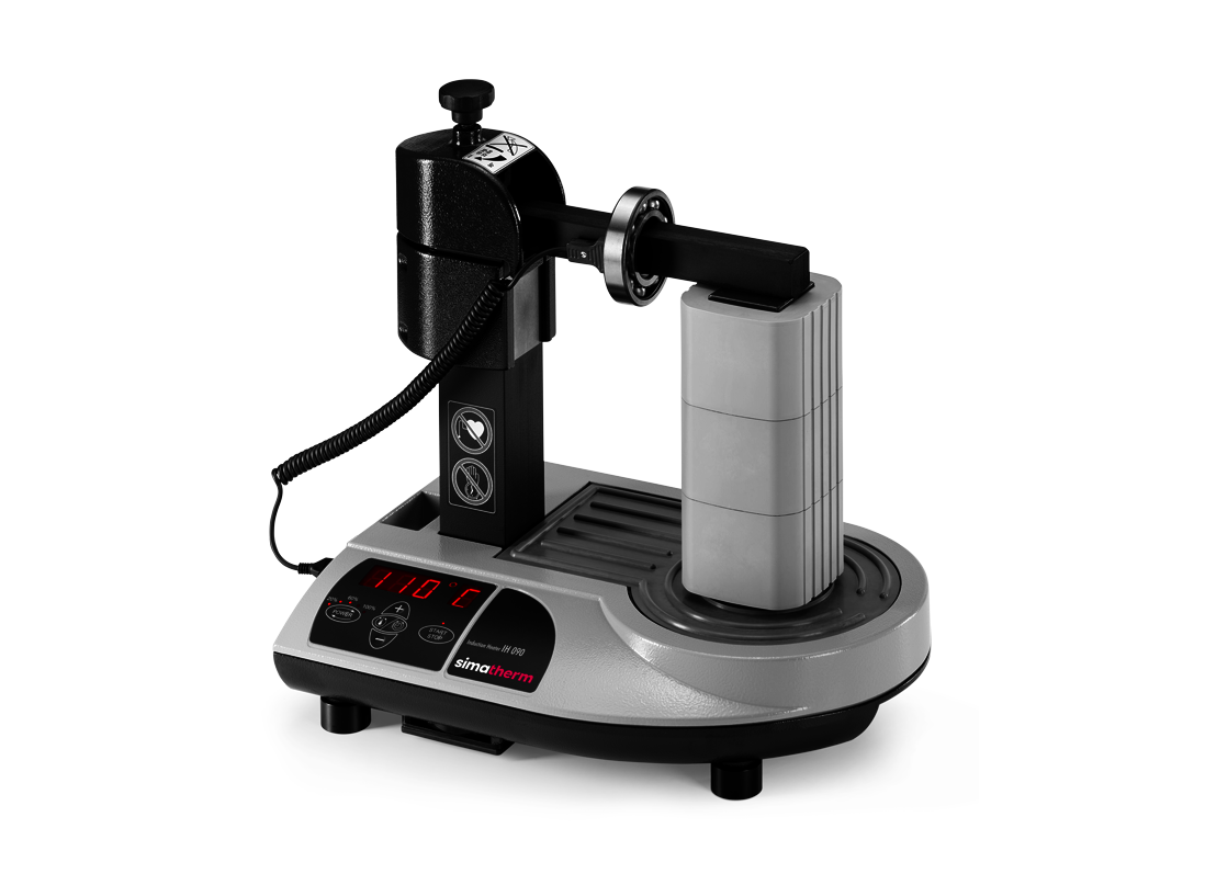 The simatherm IH 090 induction heater heats a deep groove ball bearing over the medium support yoke. The target temperature is set to 110 °C. 